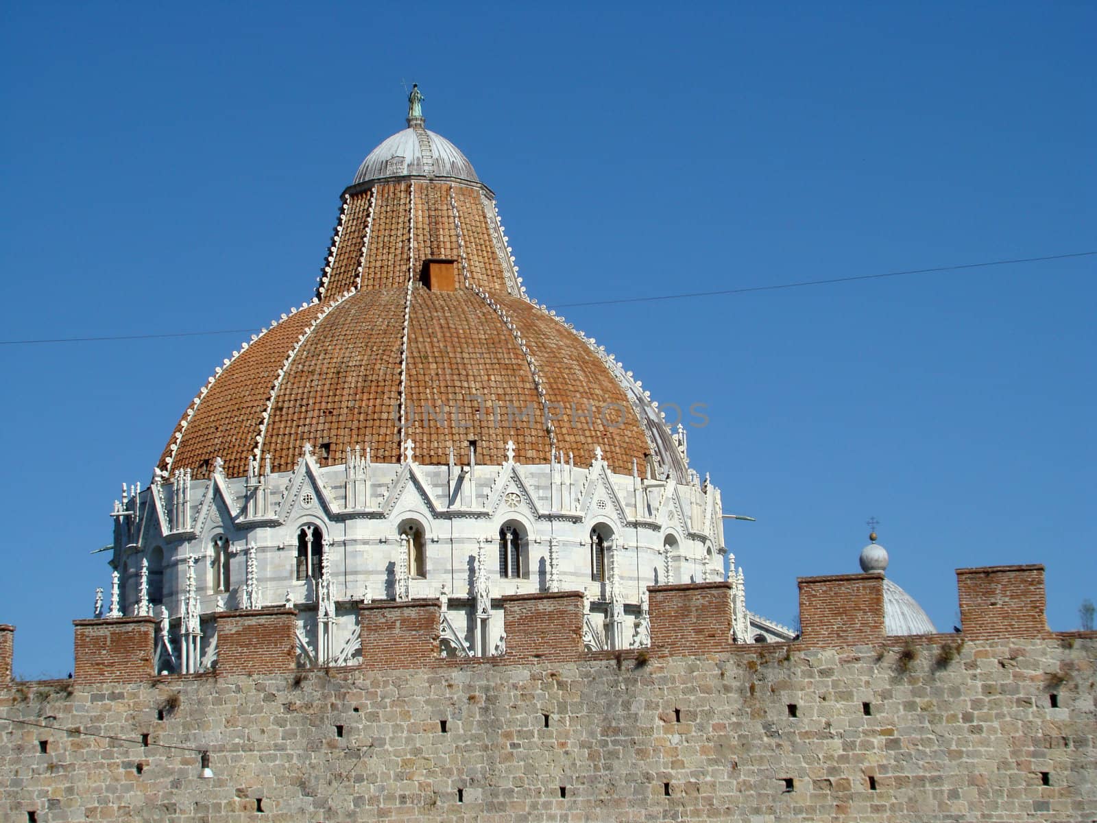 
baptistery cupola in Pisa and city walls. Tuscany.Italy.Europe2007