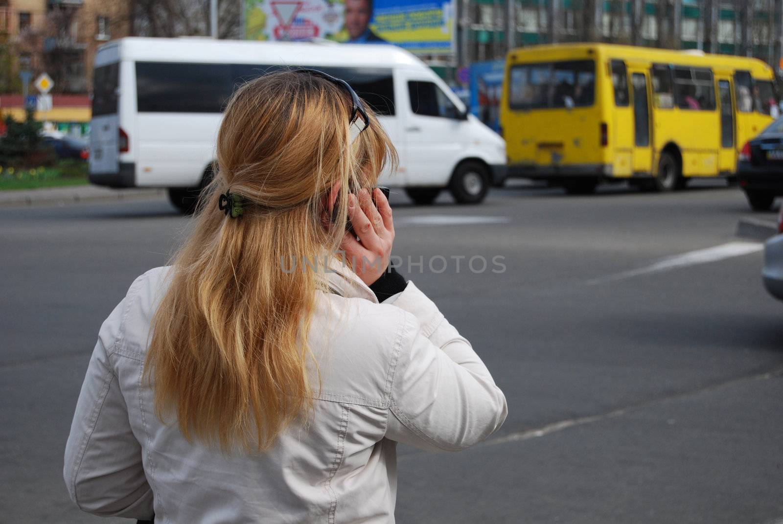 blond woman speaking on cell phone