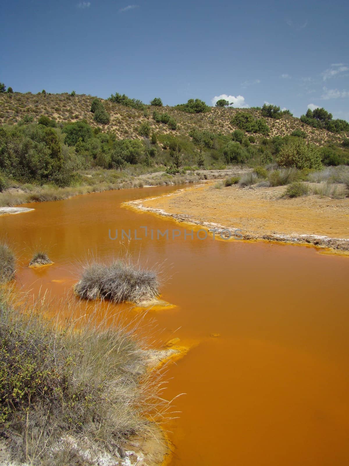 strange orange river in west part of Sardina island region of dunes. 2008