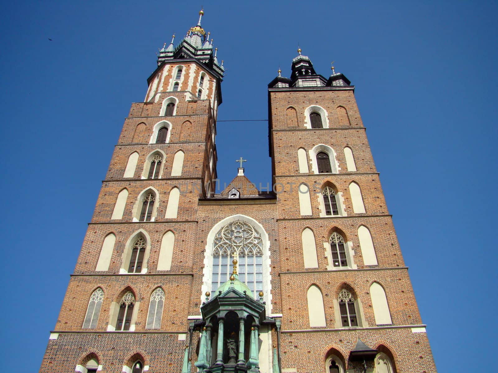 St. Mary's Basilica (Polish: Kościół Mariacki). Brick Gothic church built in the 14th century adjacent to the Main Market Square in Cracow Poland Europe 2008.