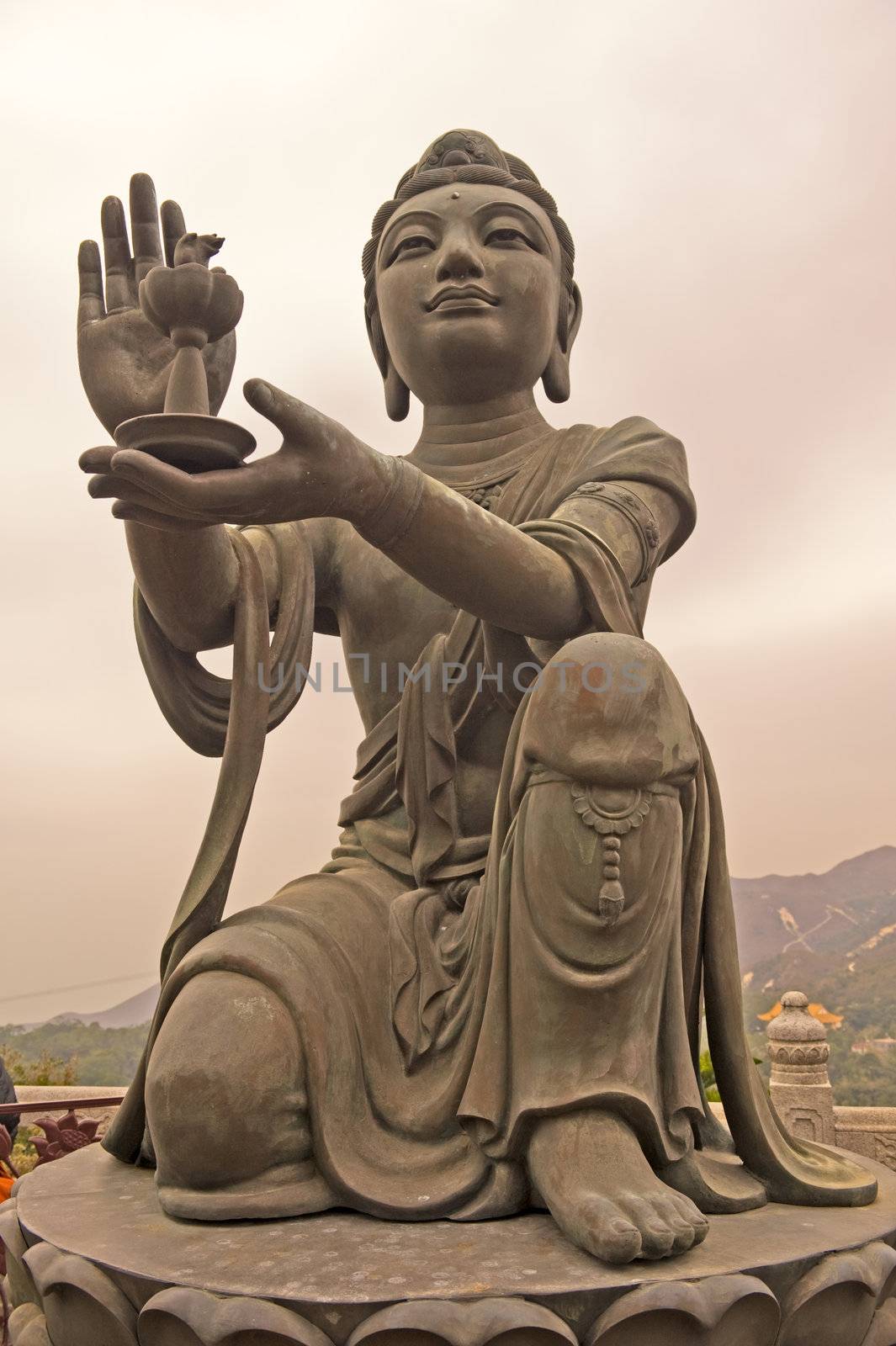 Statue in front of Buddha in Hong Kong  by Marcus
