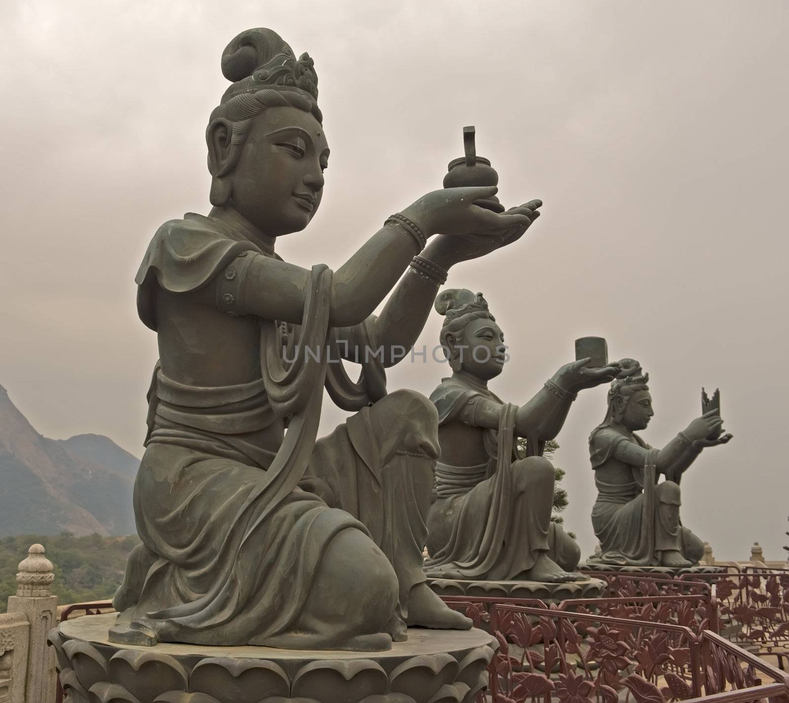 three Nirvanas monuments in front of Buddha in Hong Kong China