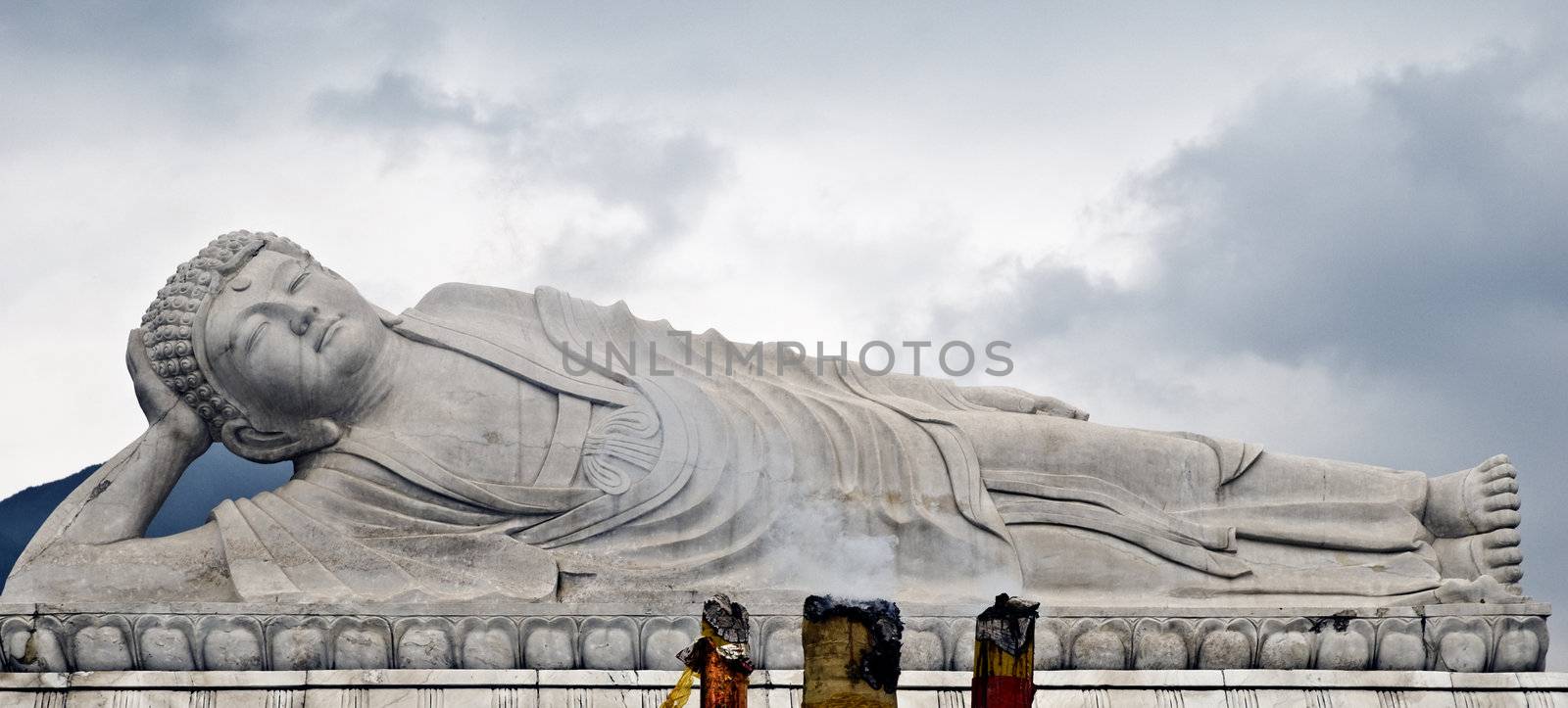 Sleeping Buddha in China cloudy sky on backround