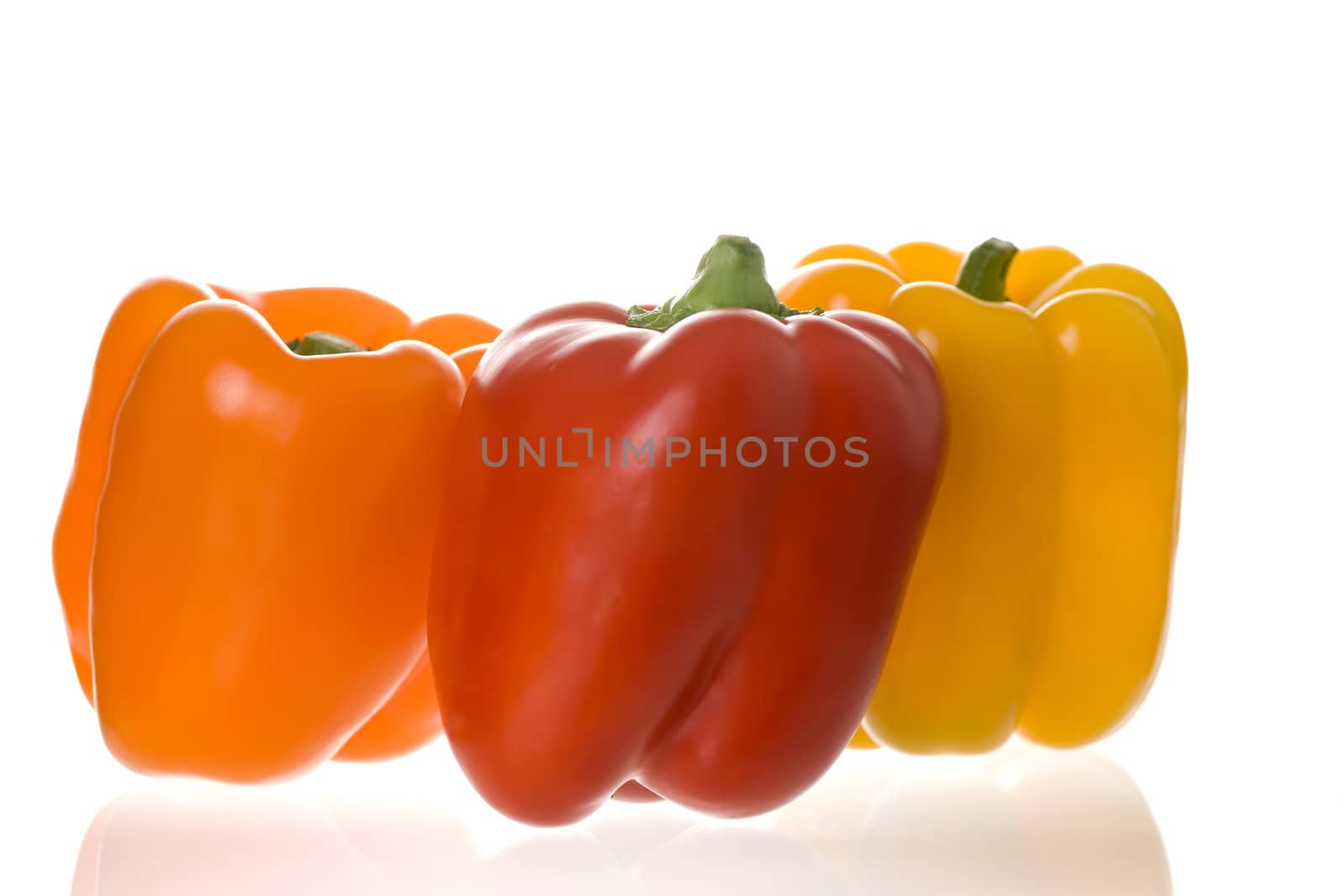 Healthy food samples three fresh peppers red yeyellow and orange