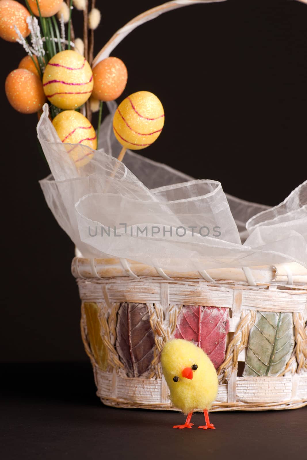 Easter backet and chicken with colored eggs