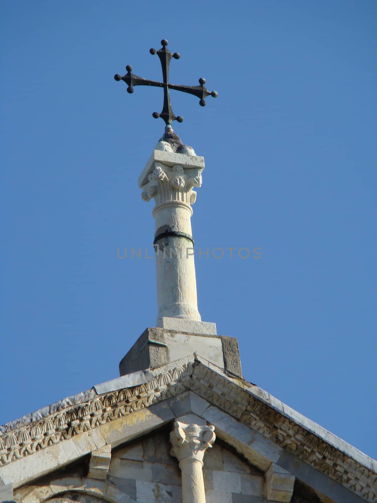 cross on the roof of th historical church