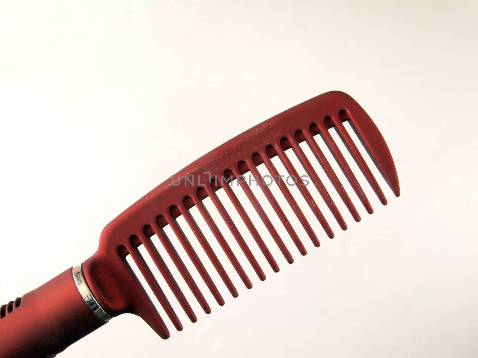 Close-up of a plastic comb used for hairstyling.