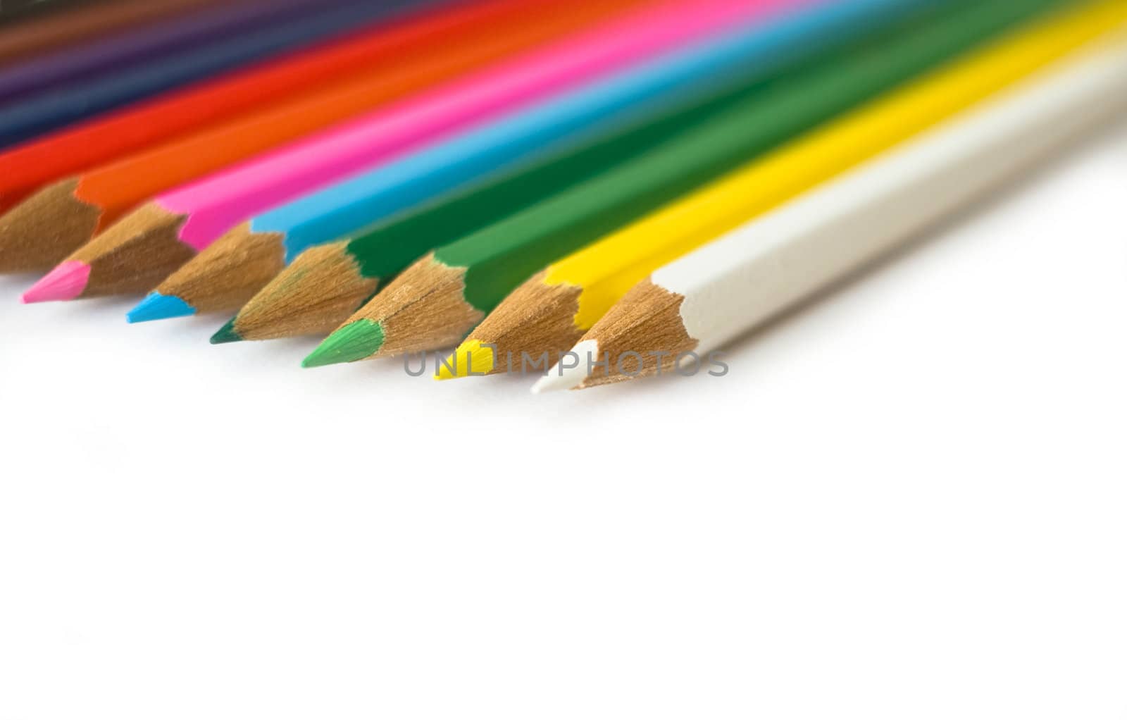 Close up colored pencils at white background