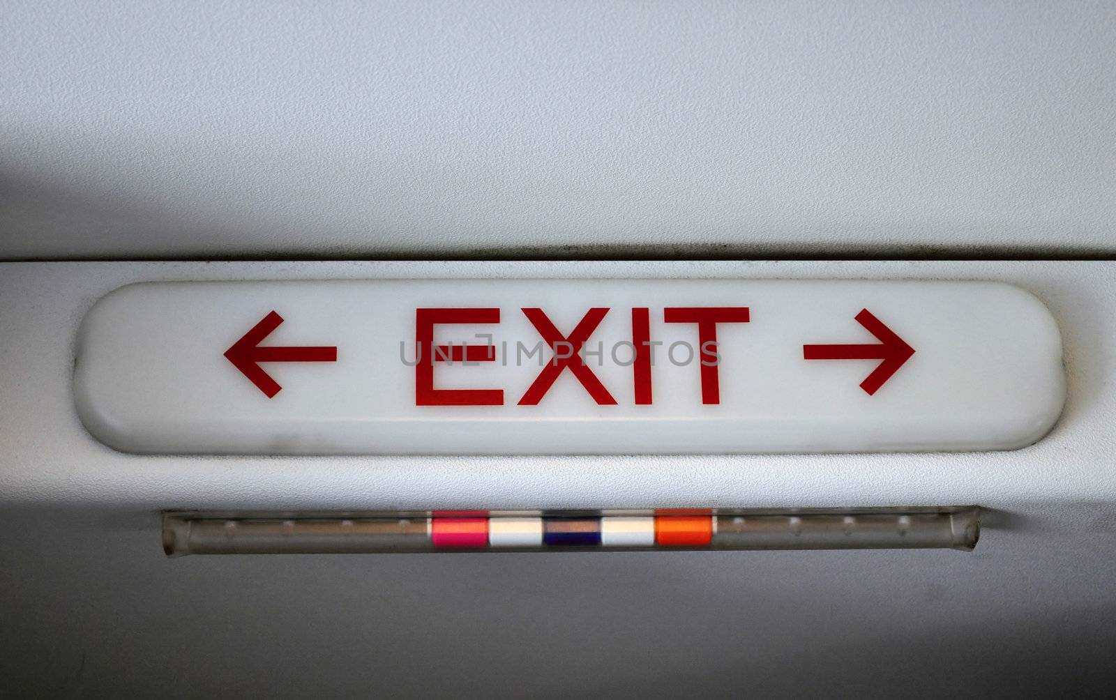 Exit sign in passengers cabin of commercial airliner