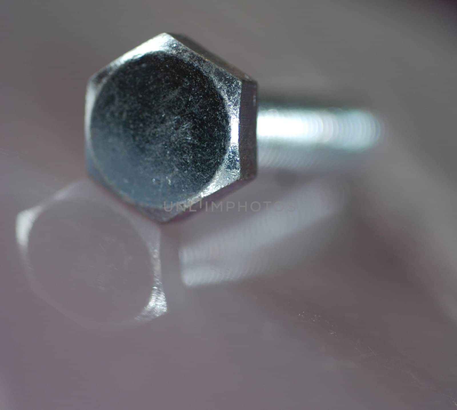 A zinc-plated screw with a hexagonal head