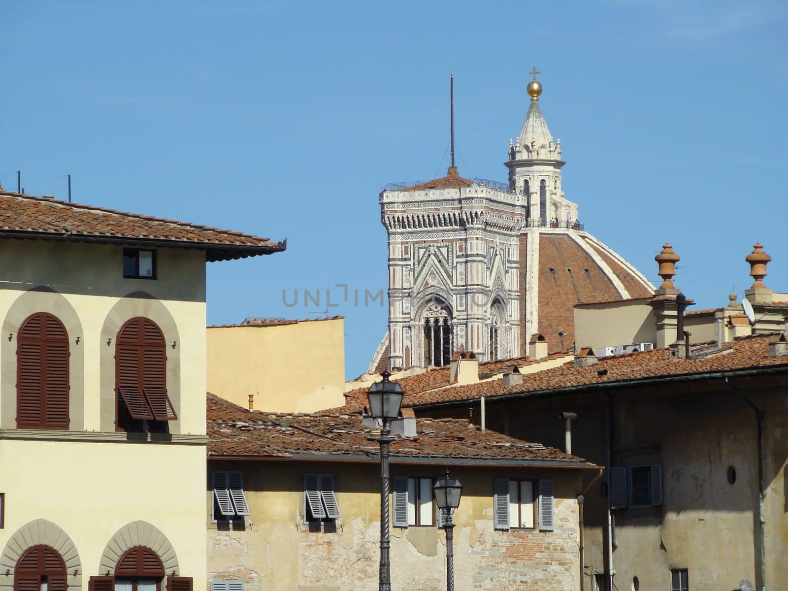 roofs of Florence, palaces in front of the Palazzo Pitti, campanile of Giotto end cupola of the cathedral, Firenze, Tuscany, Italy.