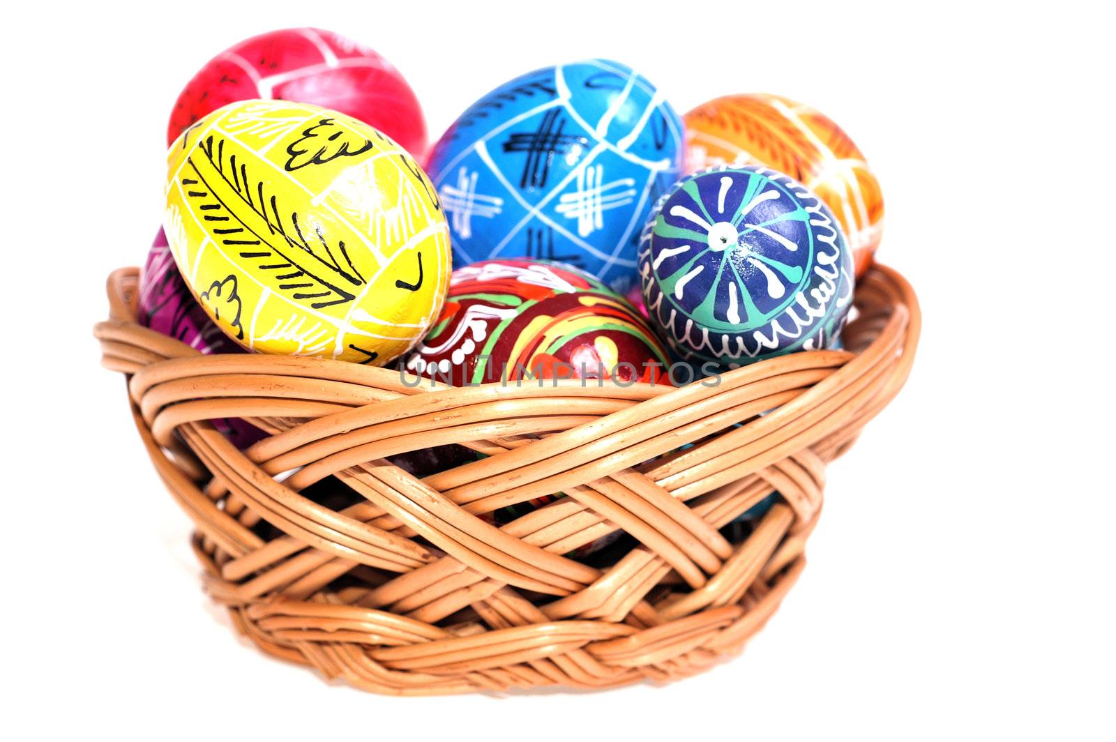 Easter egg in basket isolated