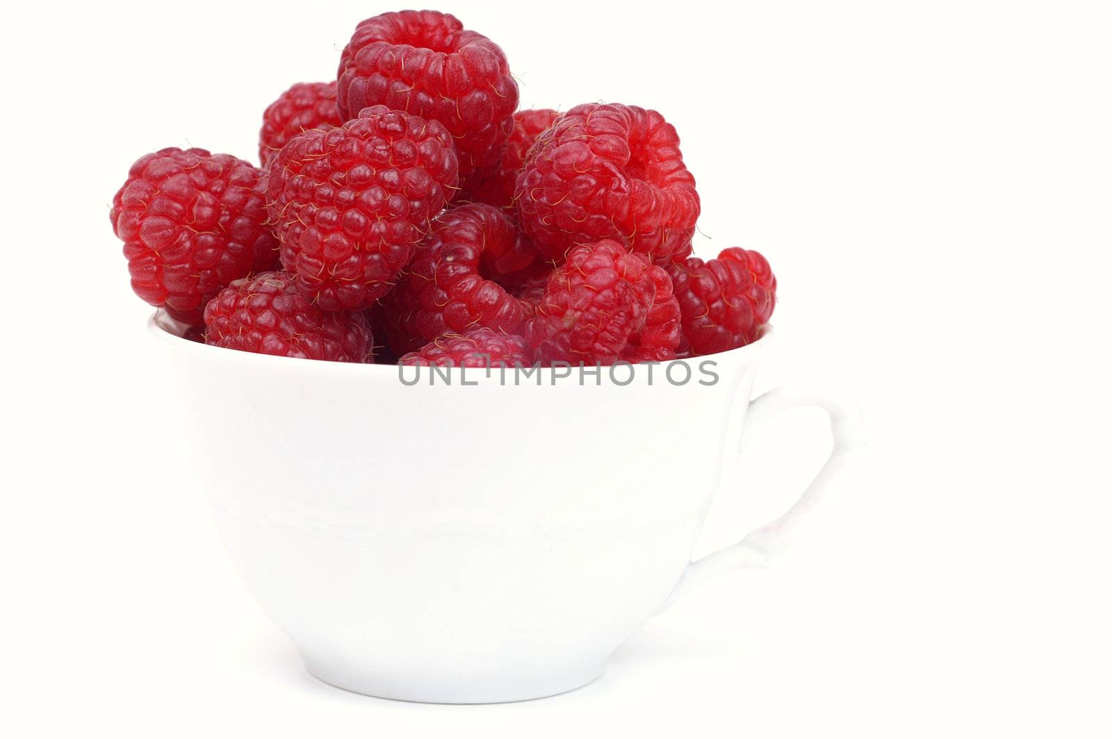 Raspberry on glass  cup