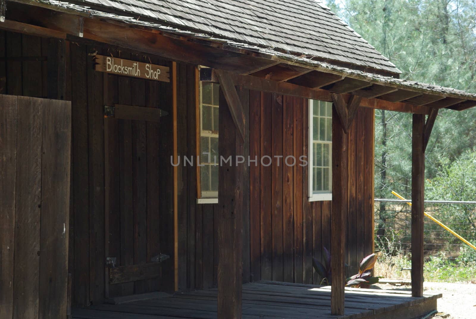 An Old West Blacksmith building viewed from the outside.