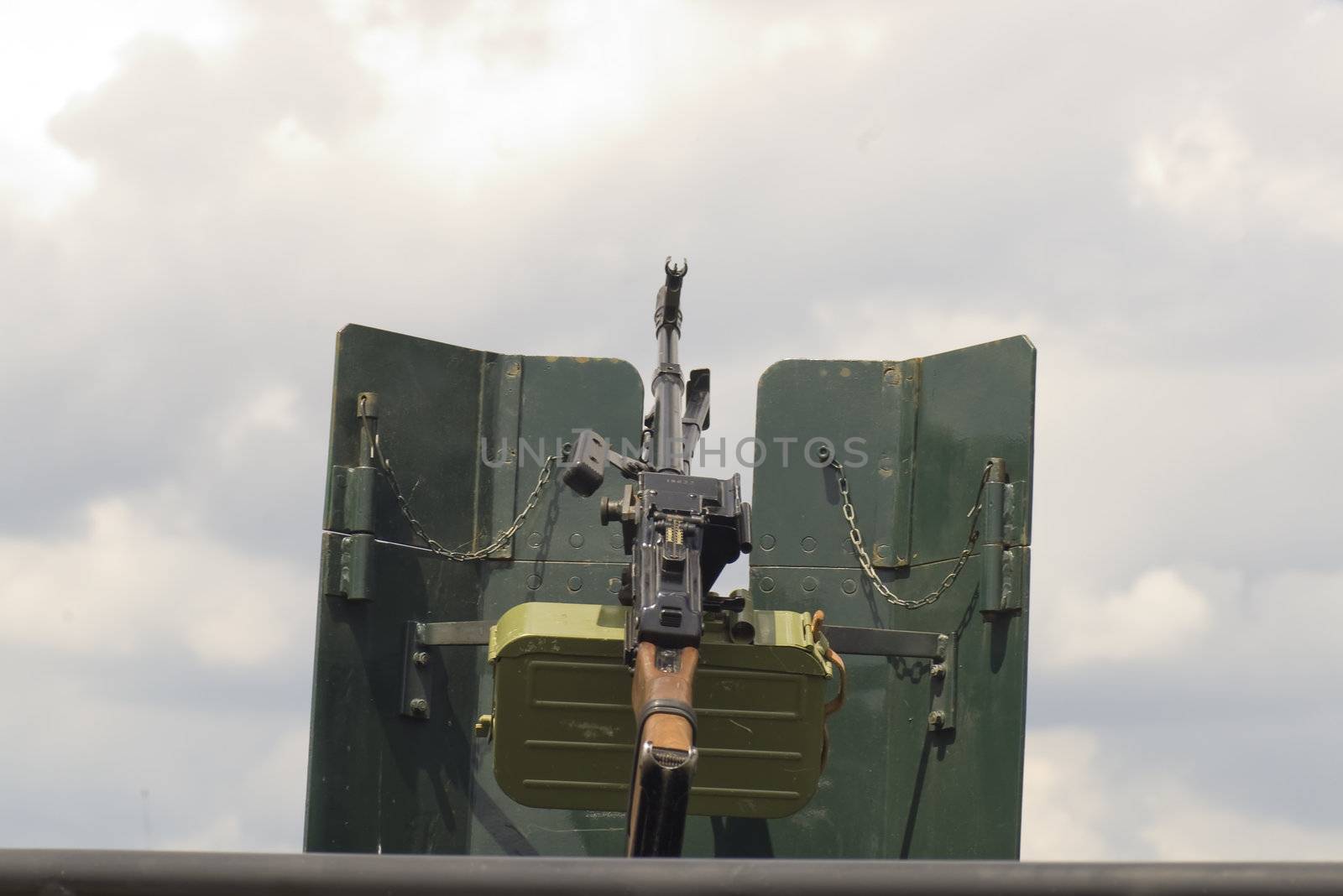 Military machine gun mounted on vehicle 