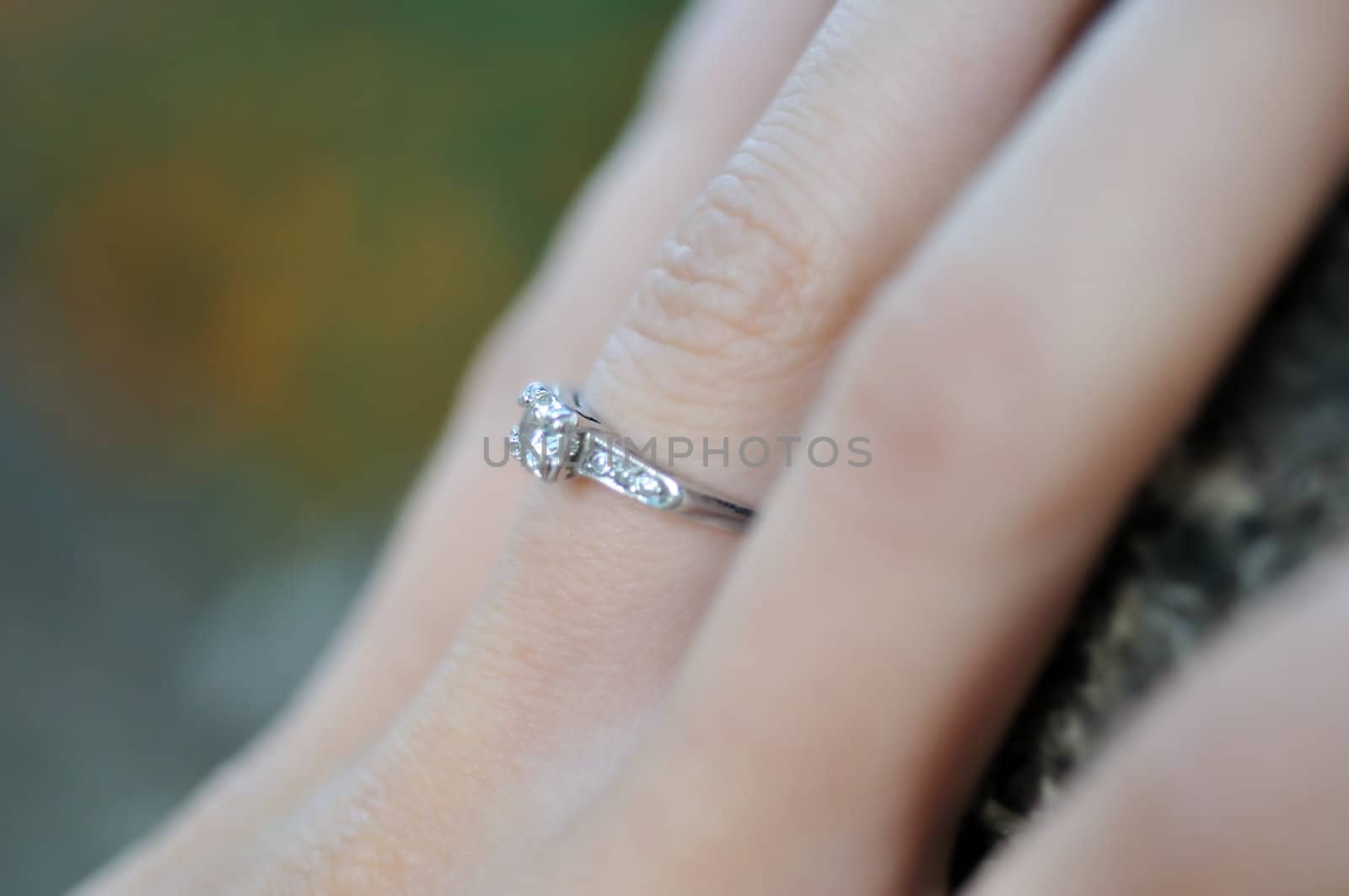 Close-up of a diamond engagement ring.  Selective focus is used.