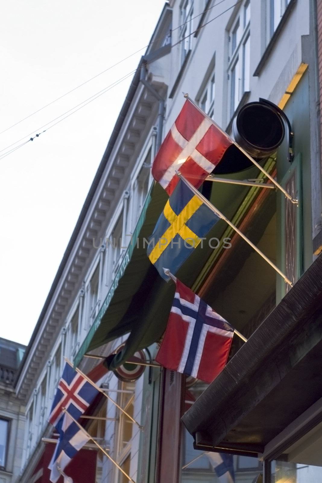 Danish and Swedish flags on facade in Copenhagen