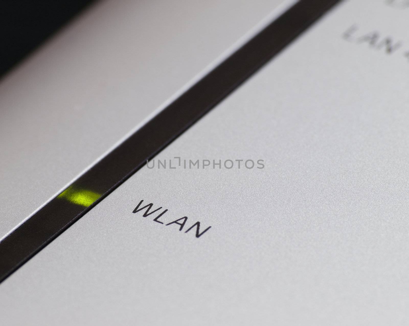 close-up of router with focus on green light and WLAN text , shallow DOF