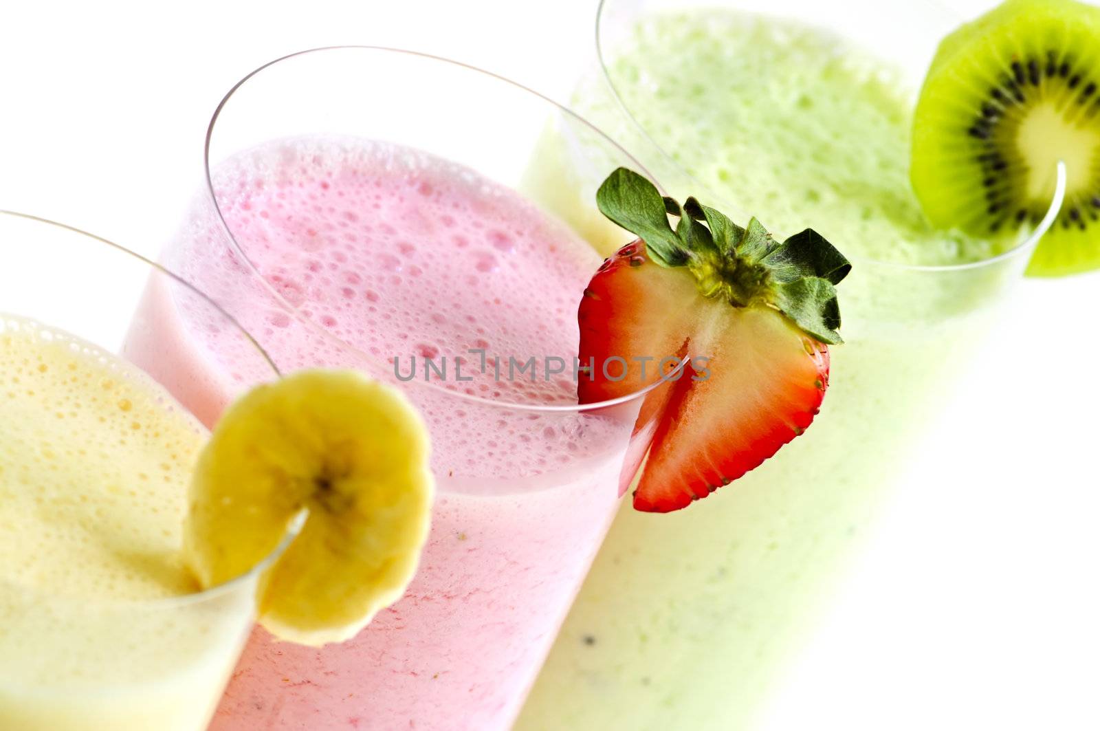Assorted fruit smoothies close up on white background