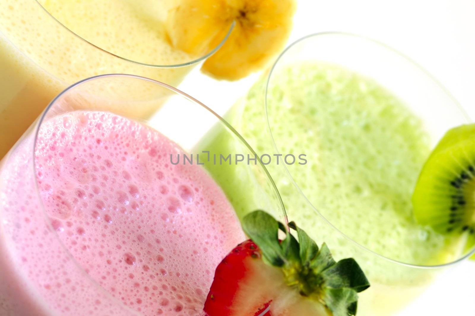 Assorted fruit and berry smoothies close up