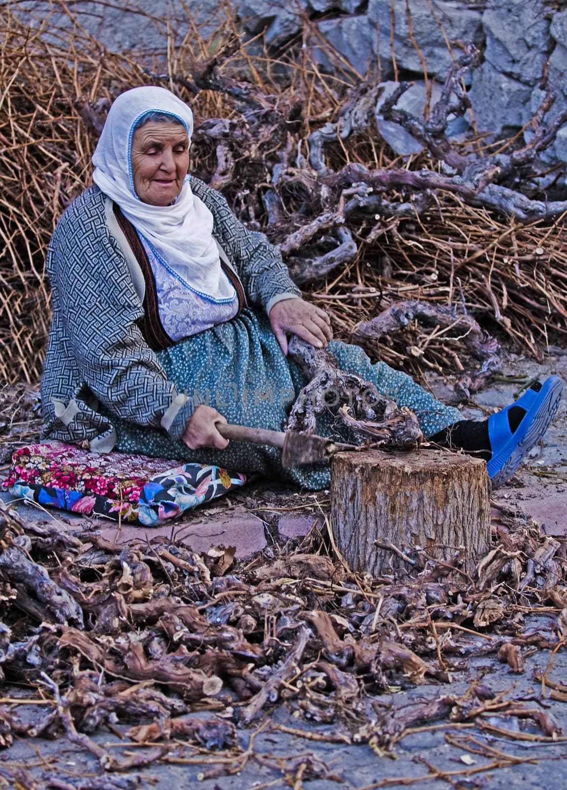 April 2008 village in Turkey - traditional old Turkish woman working outside