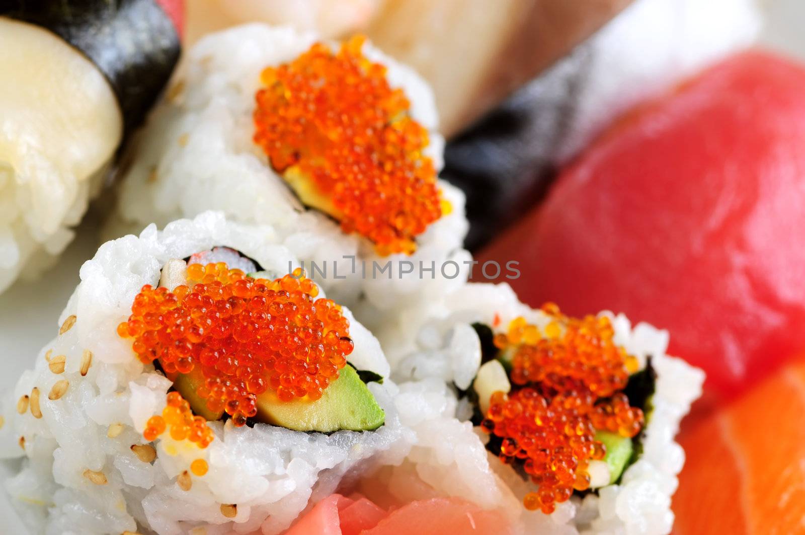 Sushi and california rolls on a plate macro