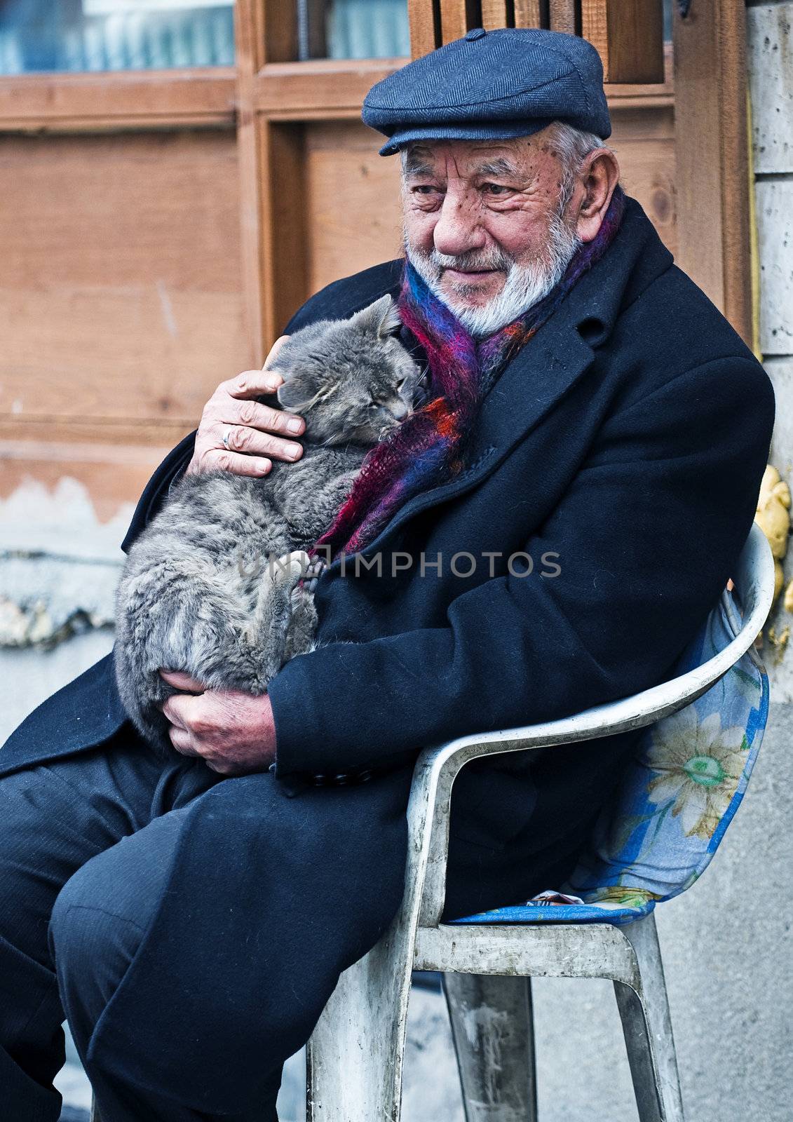 Ankara Turkey  April 2008 -  old turkish man holding a cat