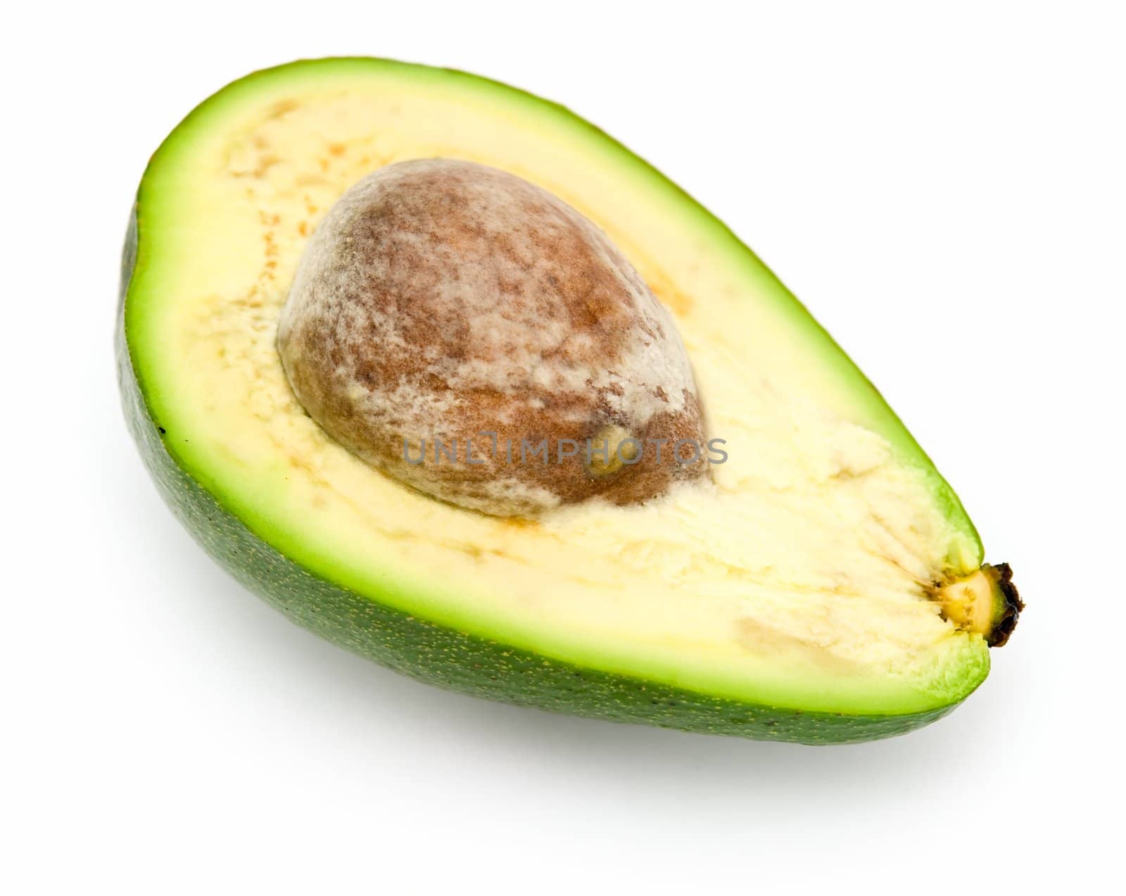 Half avocado with stone on a white background