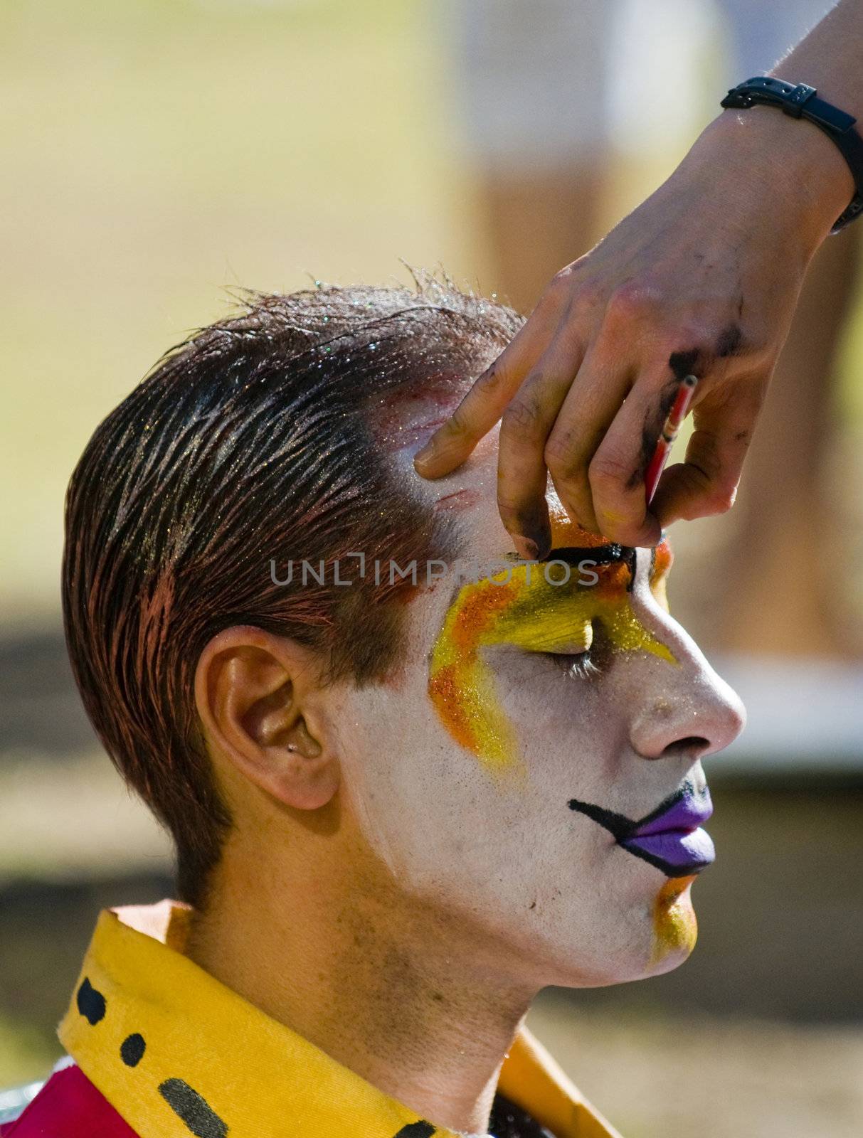 MONTEVIDEO, URUGUAY - FEBRUARY 1: A carnaval participant has his face covered with makeup prior to participating in the annual national festival of Uruguay. The main events and activities of this "fiesta" is usually made in Montevideo along with other activities in the inner towns and cities. Each year, government and citizen partnership make it sure that the Carnival will be special and unique for each and every year.

 