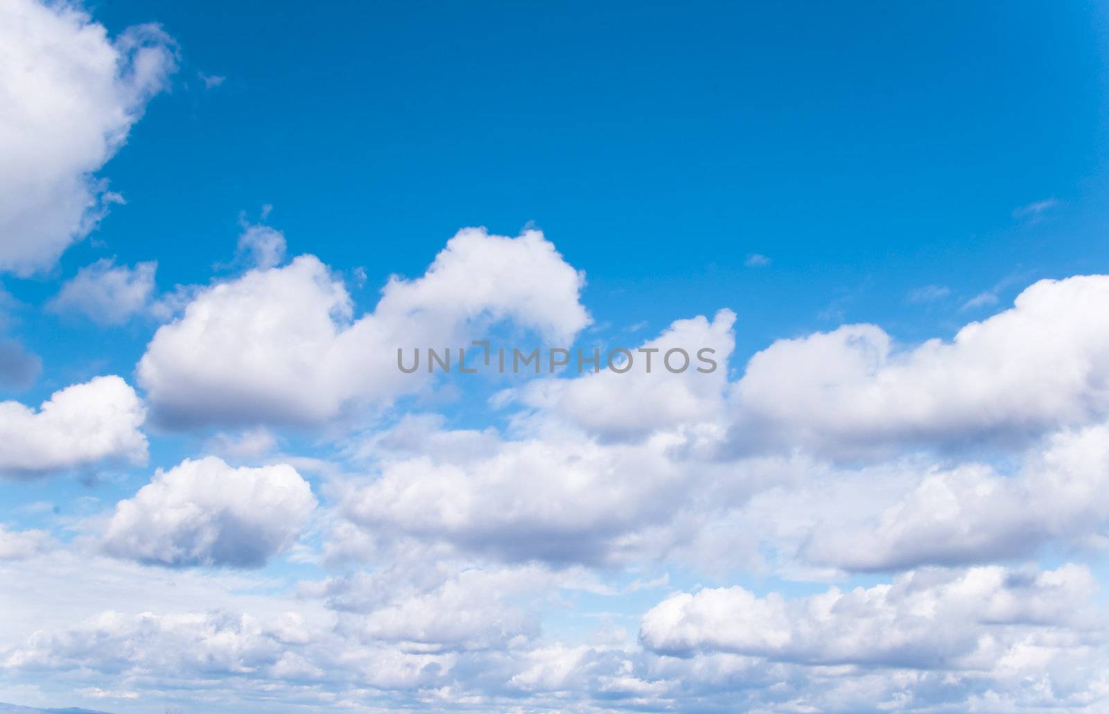 Bright blue sky with clouds