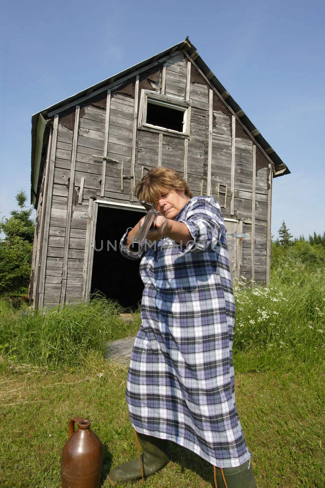 Moonshine Momma wants you off her property, or she'll fill you full of holes from her rather large shotgun.
