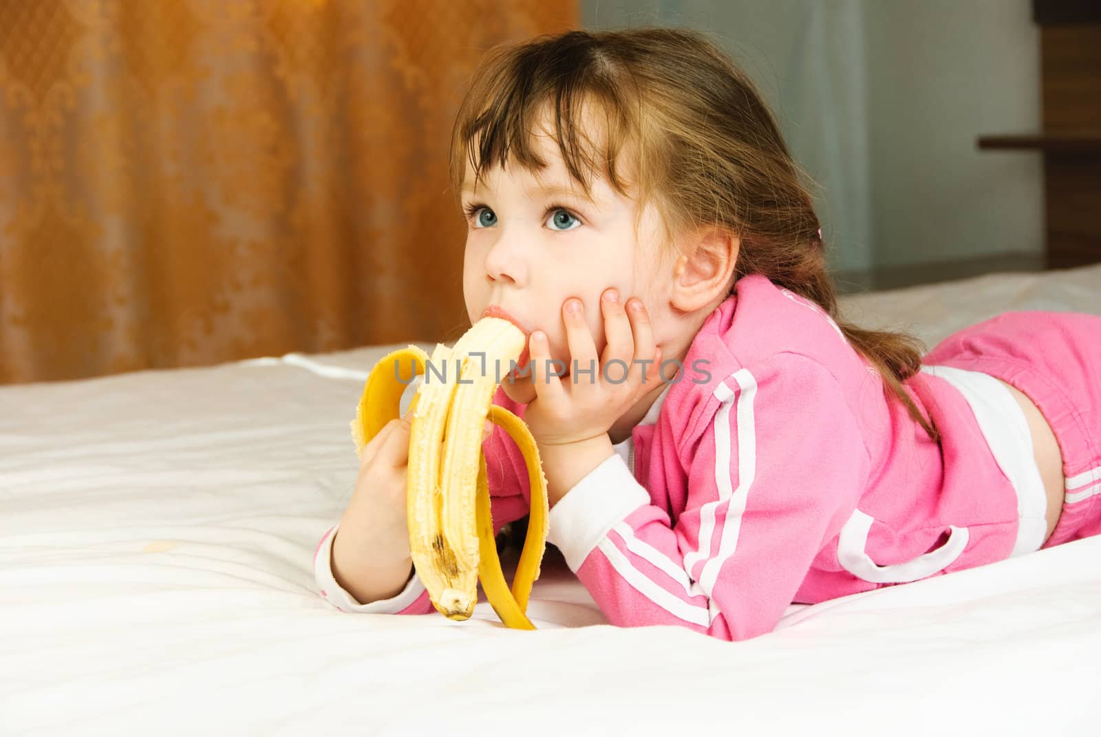 little girl eating a banana by lanak