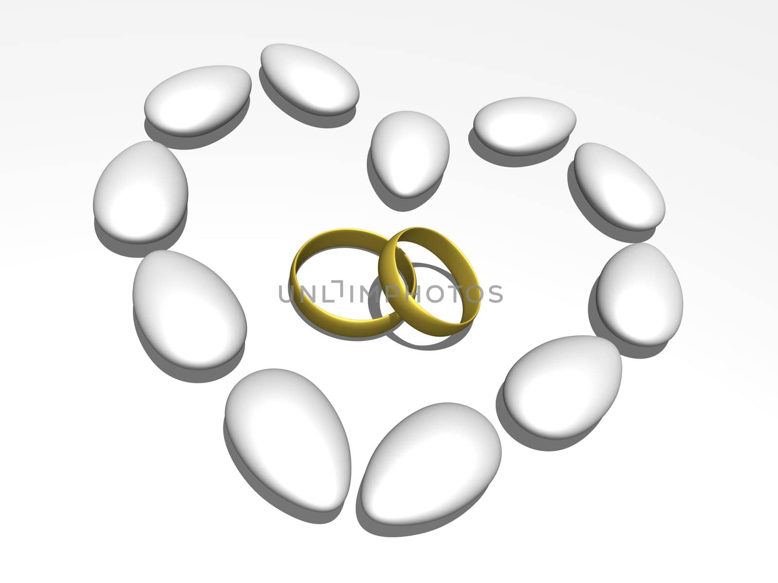 Wedding rings within a heart formed by sugared almonds