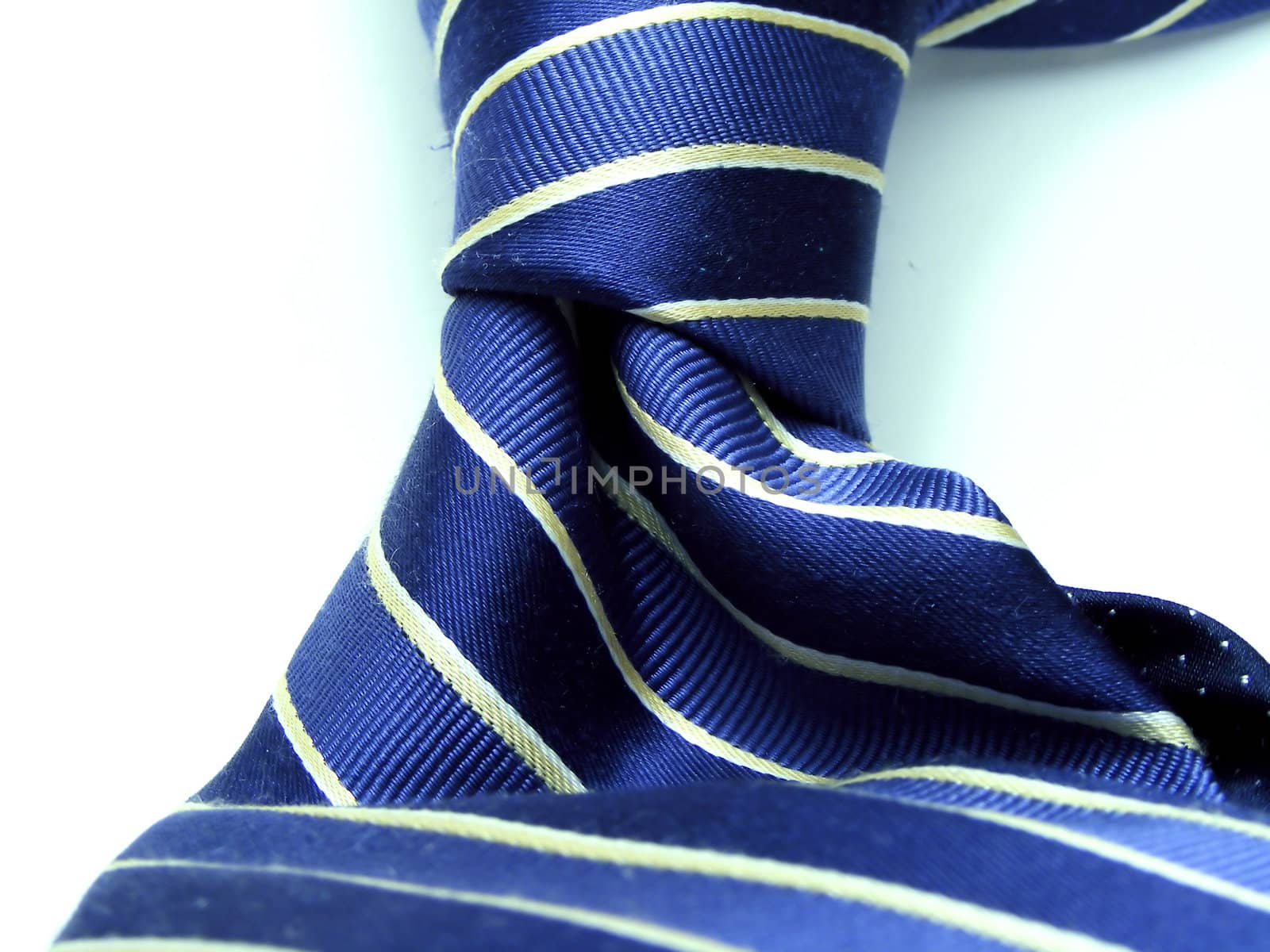 Striped designer silk tie on white background.