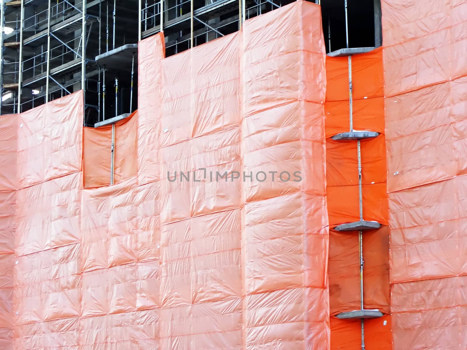 Orange construction tarp protecting the interior of this new condo.