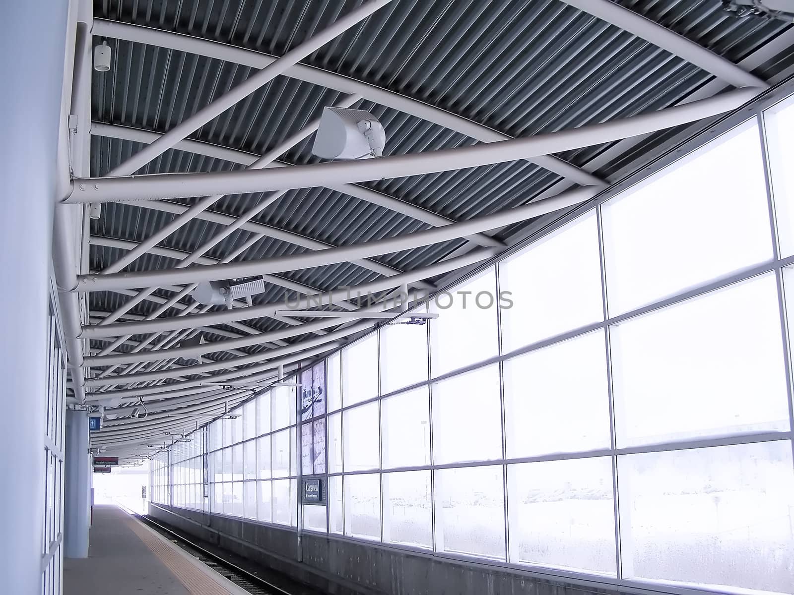 Waiting at a rail station during a winter snow storm.