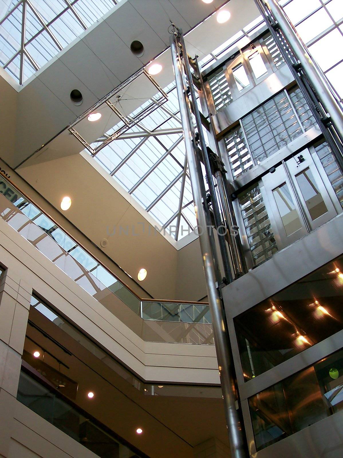 Clear glass elevator in city center mall.