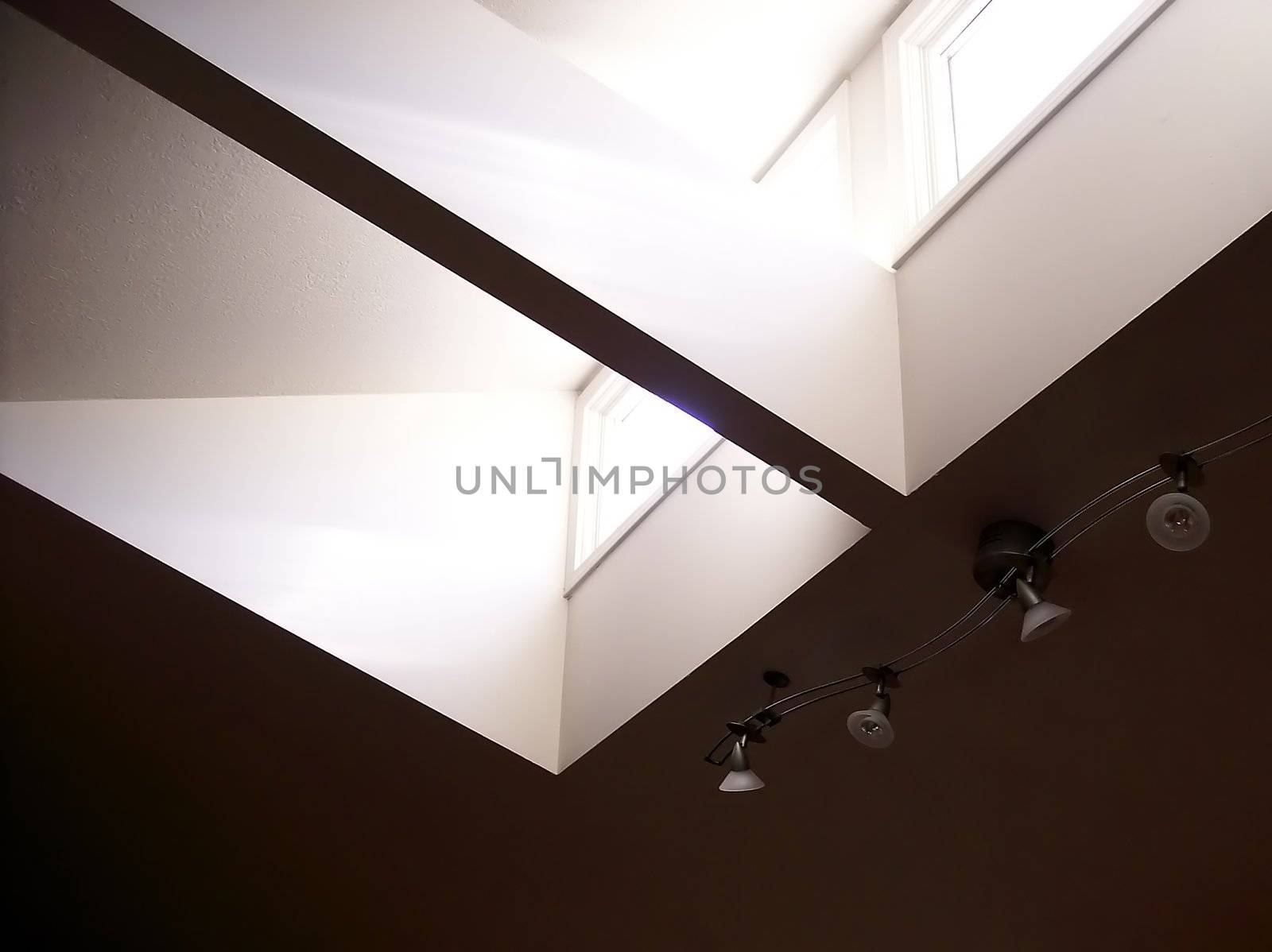 Sunlight streaming in through living room skylight in modern home.