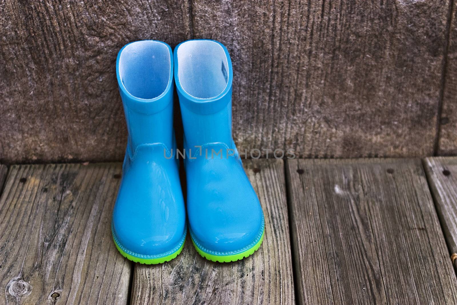 Child's blue rain boots by StephanieFrey
