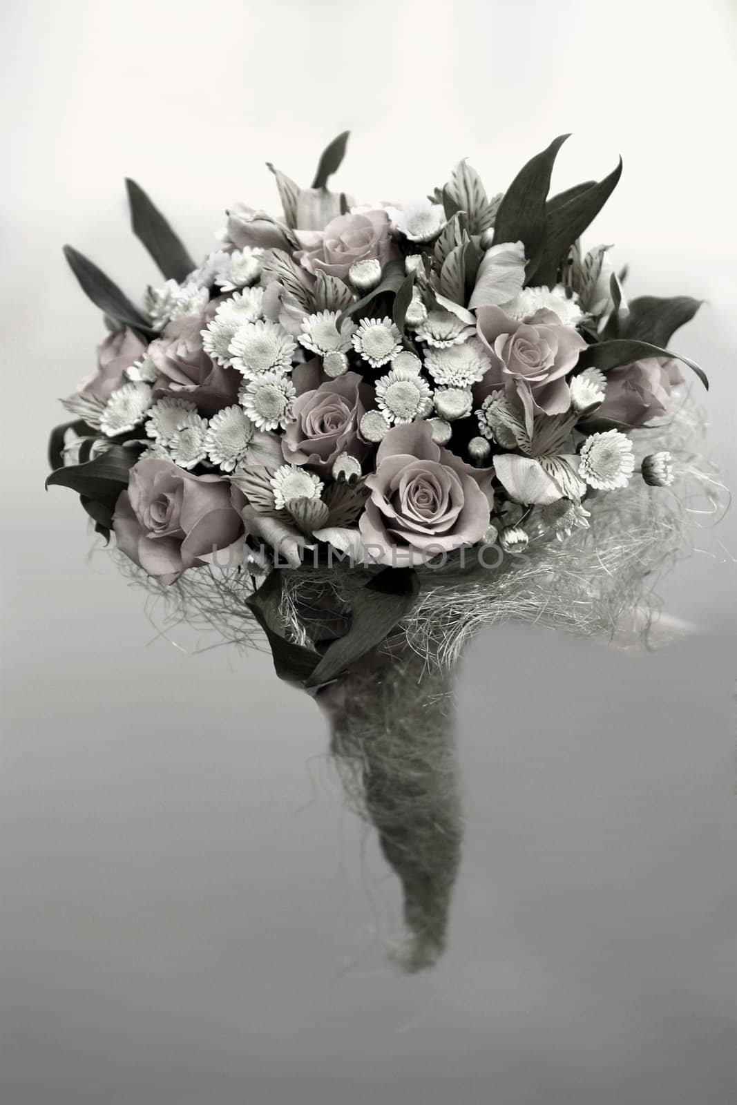 Wedding bouquet in a hand of the bride