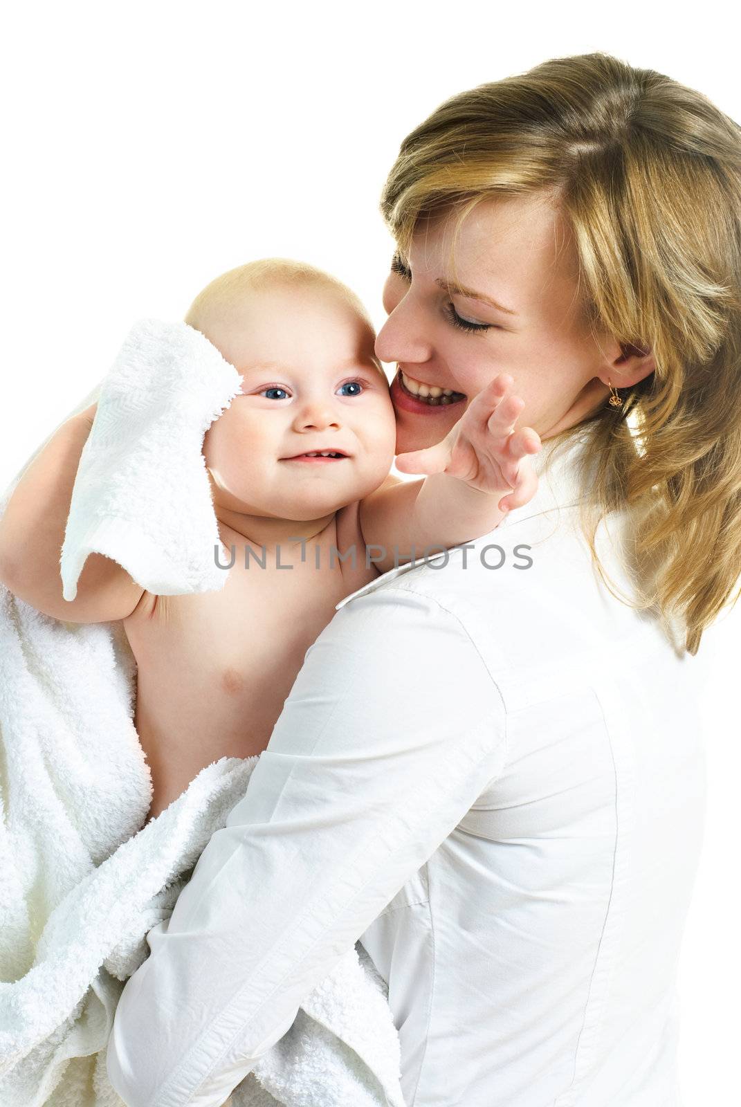 young happy beautiful mother with her little baby wrapped into the towel against white background