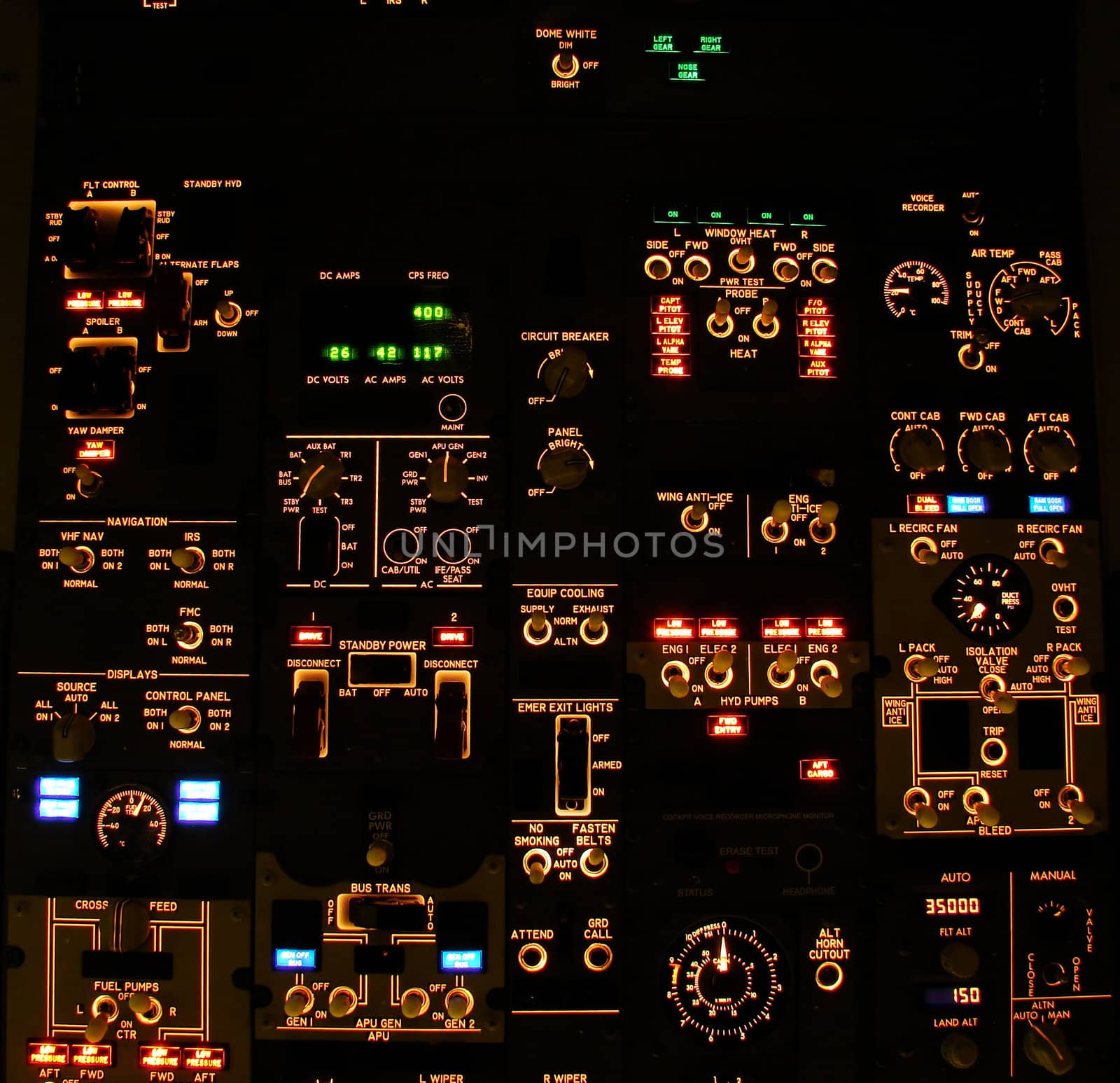 Overhead control panel of a modern airliner at night (Boeing 737-800 Next Generation).