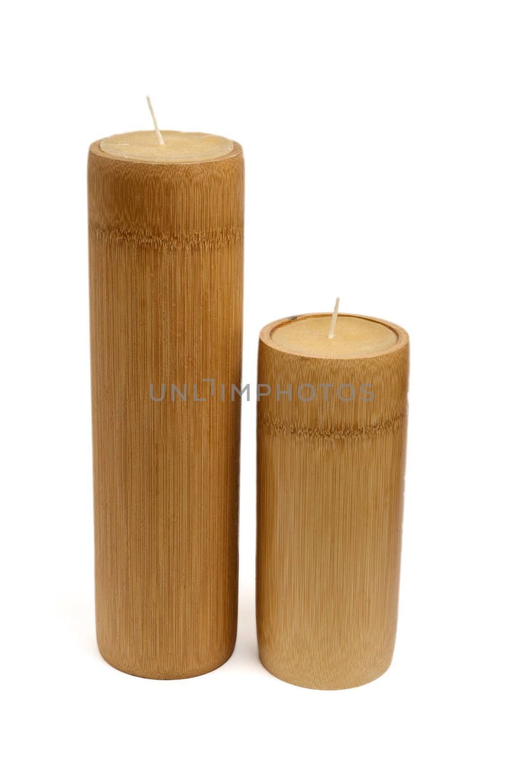 two wooden unlit candles, isolated on white