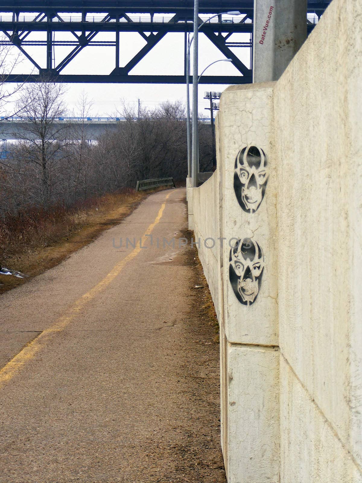 Stencil graffiti along the river valley biking trail.