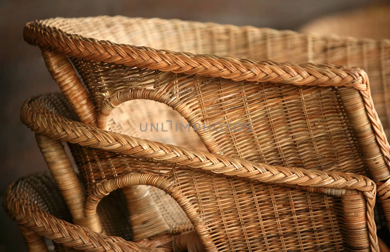 The end of a season. Three wicker chairs
