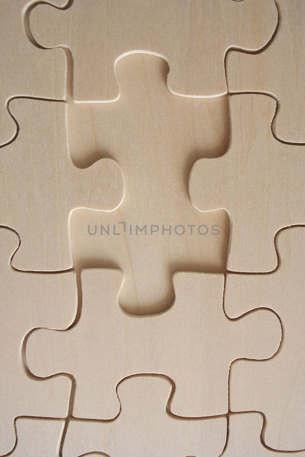 Wooden jigsaw pattern with one empty space