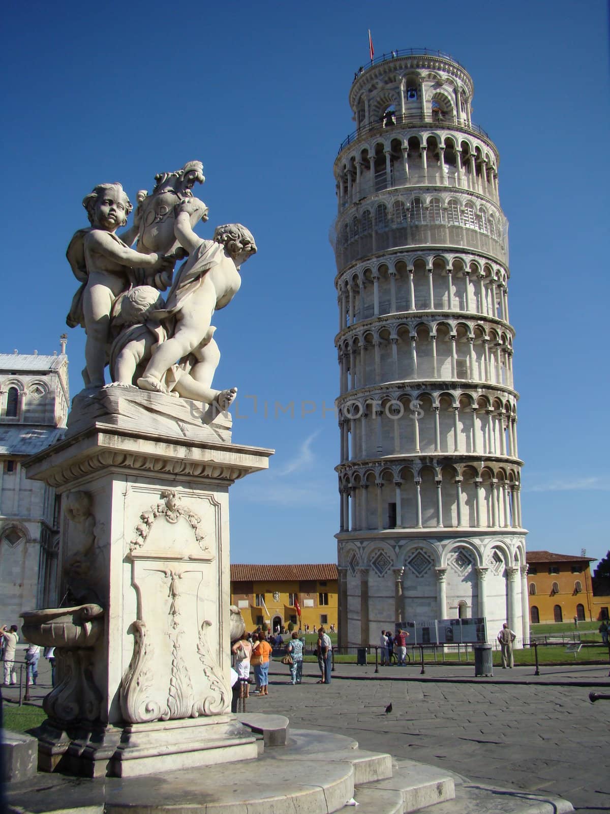 monument with angels and tower in Pisa on square of miracles, Tuscany, Italy.