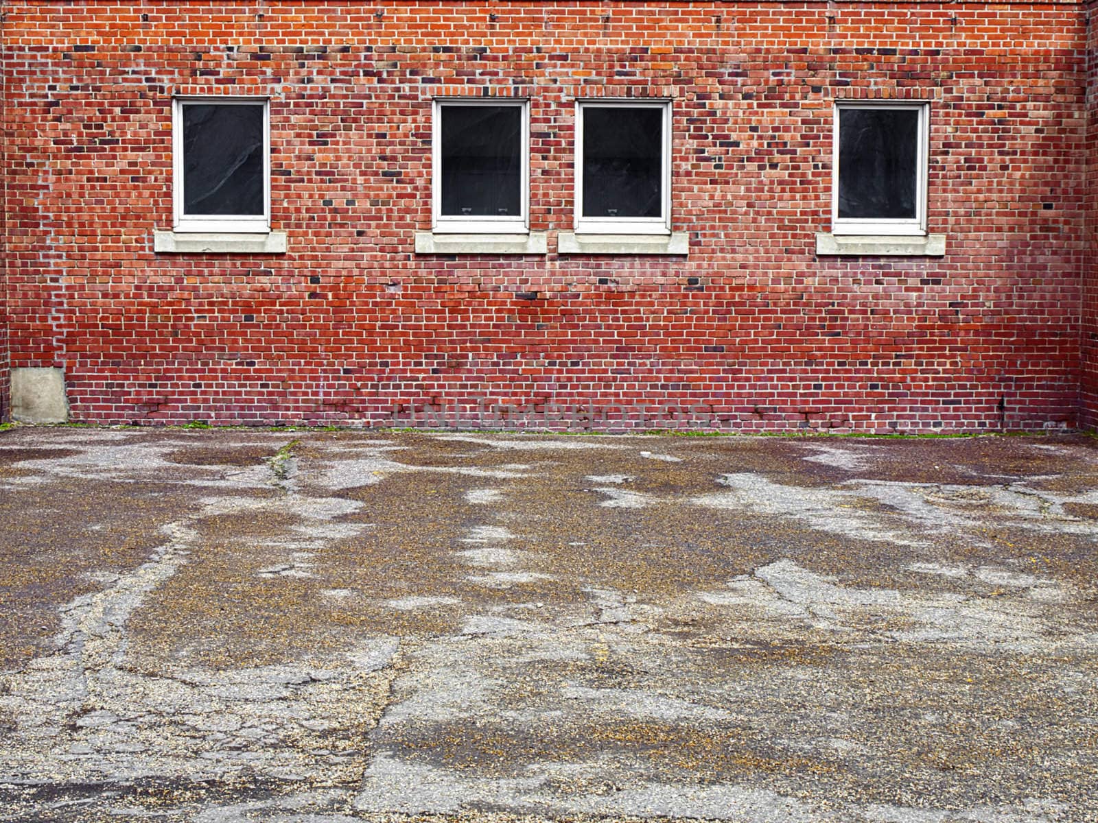 Brick building and courtyard after a spring rainfall.