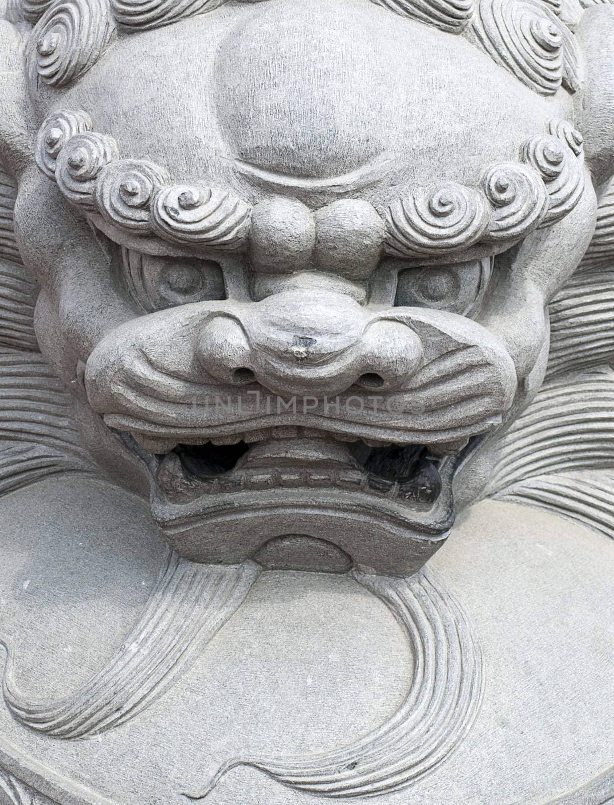 Front view of a chinese lion sculpture.