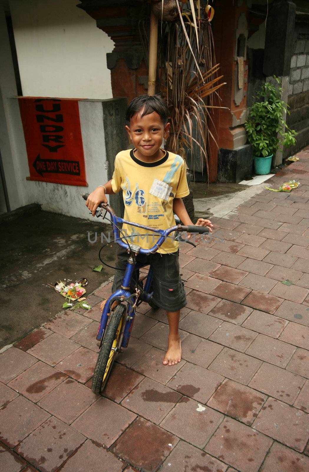 The Indonesian child on a bicycle 
